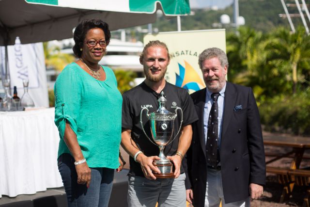 Fred Pilkington being presented the IMA Line Honours Trophy by the Honourable Yolande Bain-Horsford and RORC Admiral Andrew McIrvine - photo RORC/Arthur Daniel & Orlando K Romain