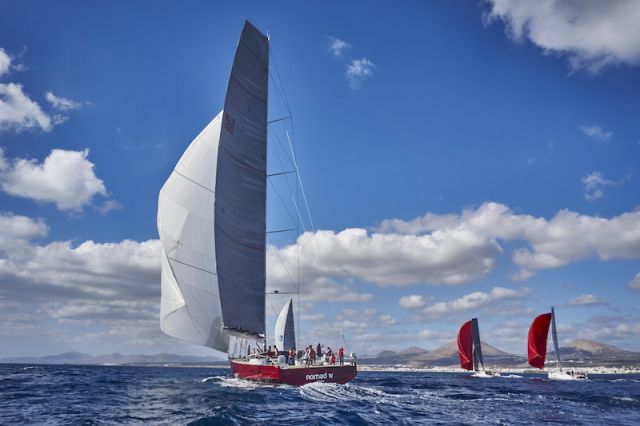 Jean-Paul Riviere's French Finot Conq 100 Nomad IV gives chase at the start of the RORC Transatlantic Race 2015 off Lanzarote © RORC/James Mitchell