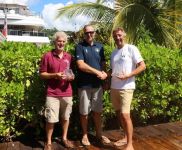 RORC Commodore, Steven Anderson presents Rupert Holmes (L) and Richard Palmer (R), owner of Jangada, JPK 10.10 with prizes for winning IRC Two and IRC Two Handed © RORC
