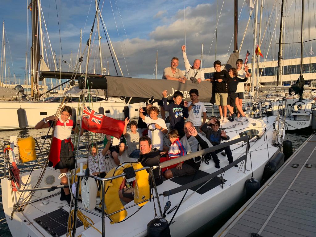 Children from the sailing school at Real Club Náutico de Arrecife climbed on board Richard Palmer's JPK 10.10 Jangada. They asked questions about what it's like to race two handed across the Atlantic Ocean © RORC