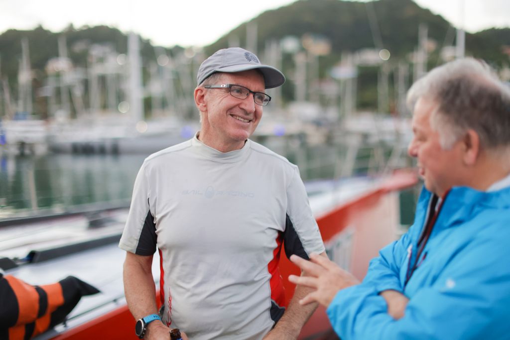 Comanche’s Australian navigator Will Oxley explains to Race Reporter, Louay Habib, the weather conditions which made for a complex winning solution © Arthur Daniel/RORC