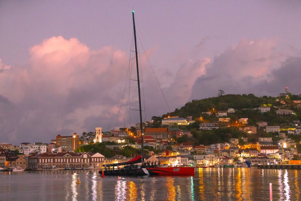 Comanche makes her way to the dock at Camper & Nicholsons Port Louis Marina Grenada just as the comes up on the 8th day of the RORC Transatlantic Race © Arthur Daniel/RORC