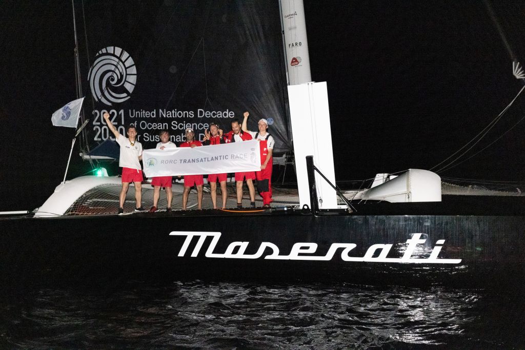 Celebrations on board Giovanni Soldini's Italian Multi70 Maserati after crossing the finish line in Grenada first after eight days of extraordinary racing in the RORC Transatlantic Race © Arthur Daniel/RORC