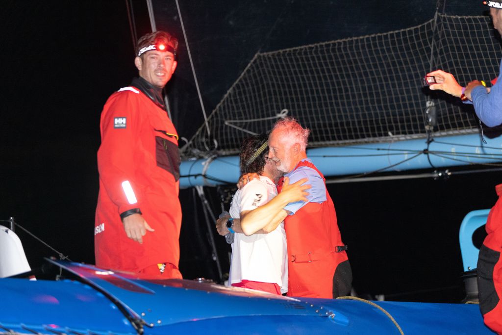 Friendly rivalry - Left: Ned Collier Wakefield, Right: Giovanni Soldini (Maserati) congratulations Peter Cunningham and the team on PowerPlay after their close battle across the Atlantic from Lanzarote © Arthur Daniel/RORC