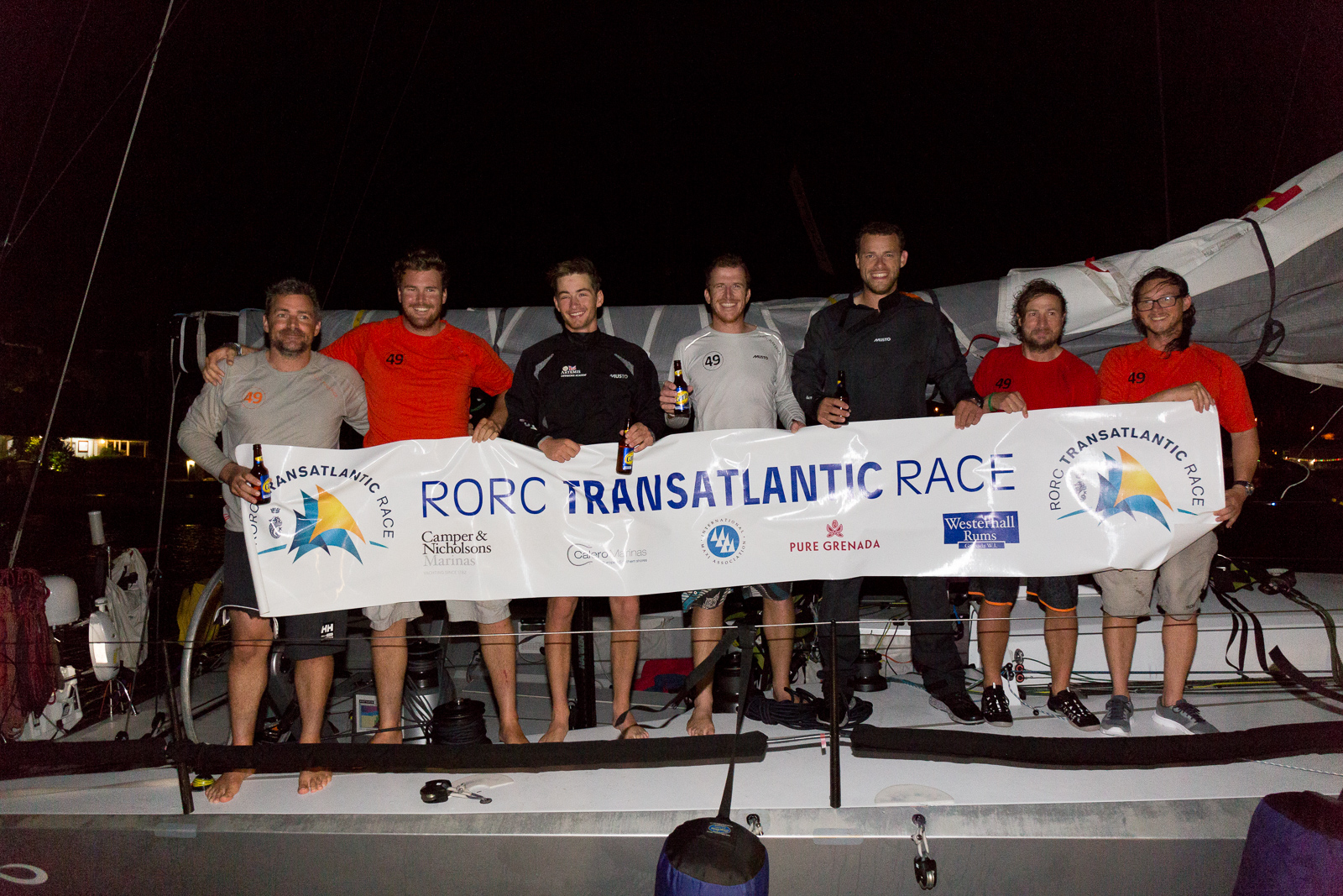 Skipper, Olly Cotterell and Team Maverick, Inifiniti 46 having crossed the finish line in Grenada celebrate dockside at Port Louis Marina in the early hours of Saturday © RORC/Arthur Daniel