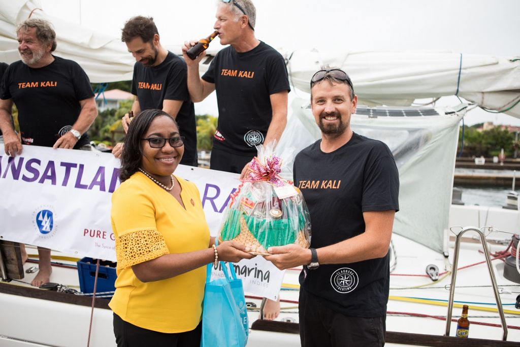 Chinel Sandy from the Grenada Tourism Authority presented Kali with a basket of Grenadian goods - Photo © RORC / Arthur Daniel