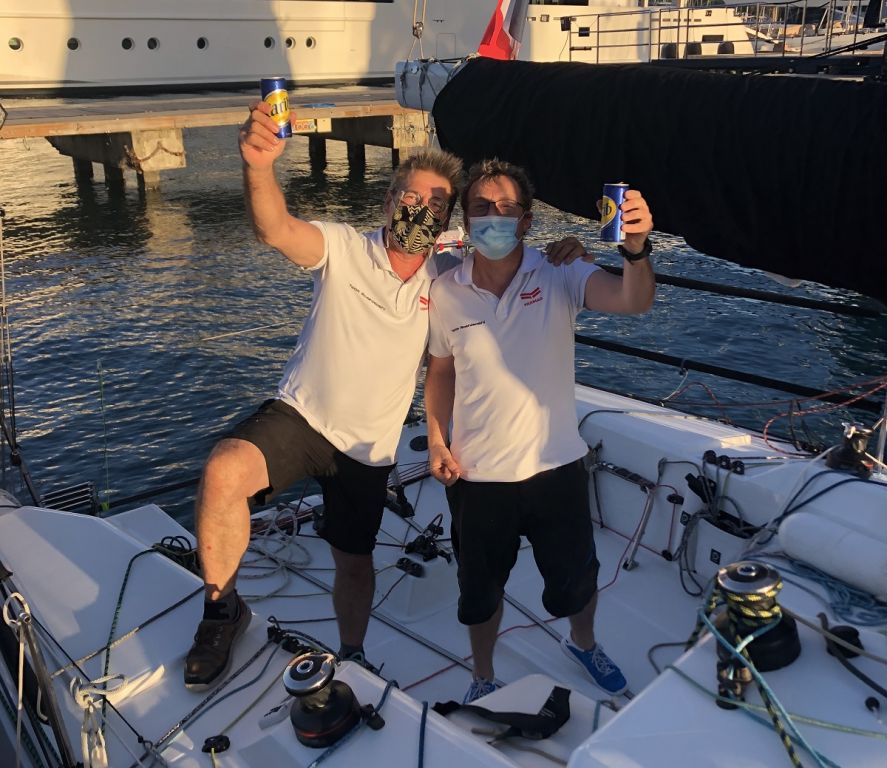 Enjoying a cold beer in Antigua after finishing the RORC Transatlantic Race: Sebastien Saulnier (R) and Christophe Affolter (L) racing Sun Fast 3300 Moshimoshi  © Helen Spooner/RORC