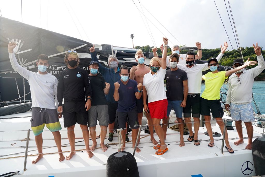 Celebrations on board Johannes Schwarz’s Volvo 70 Green Dragon after winning the IMA Trophy and Monohull Line Honours in the  RORC Transatlantic Race - Finishing in an elapsed time of 9 days, 18 hours, 53 mins and 40 secs © Ed Gifford/RORC
